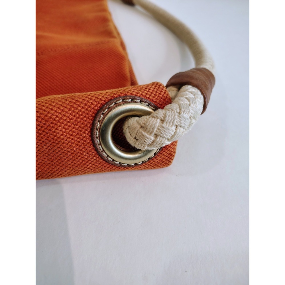 Michael Kors Marina hobo bag features an orange canvas body with braided rope... - Picture 4 of 11